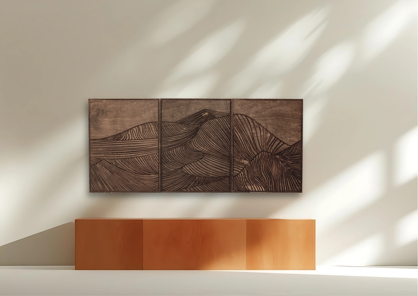 Wooden wall art with mountain design on a white wall
