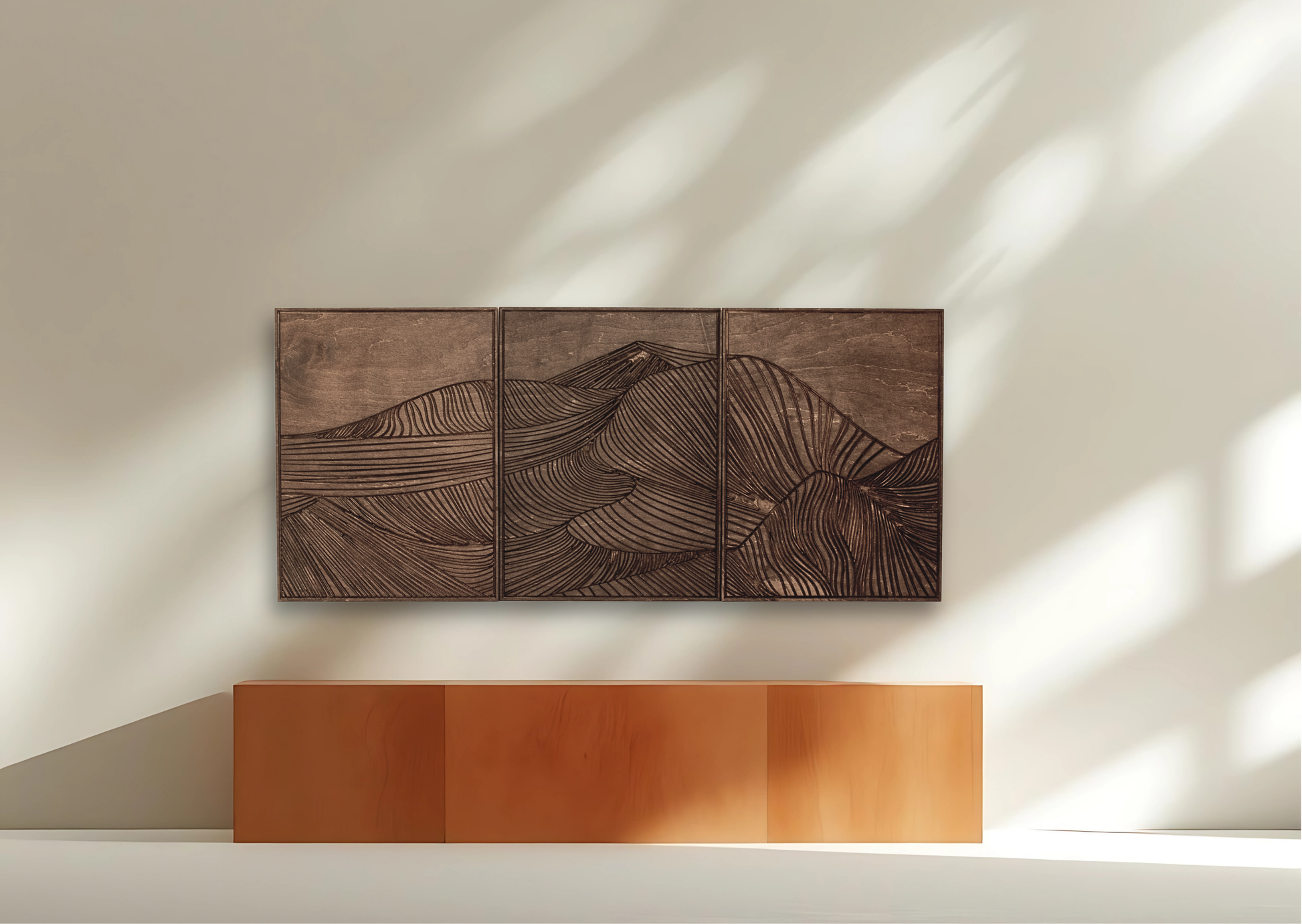 Wooden wall art with mountain design on a white wall