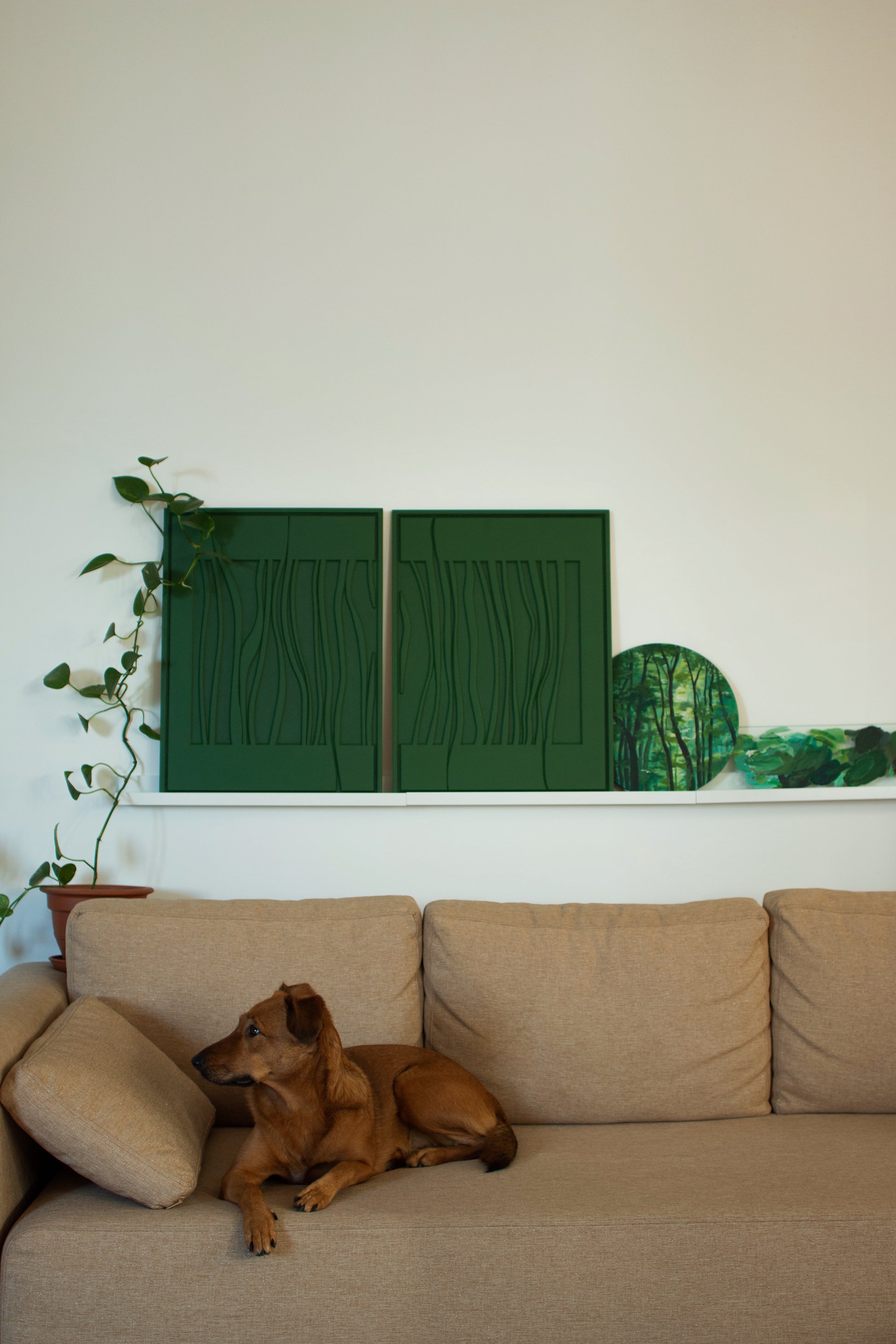 Handmade green wall art with carved curved lines