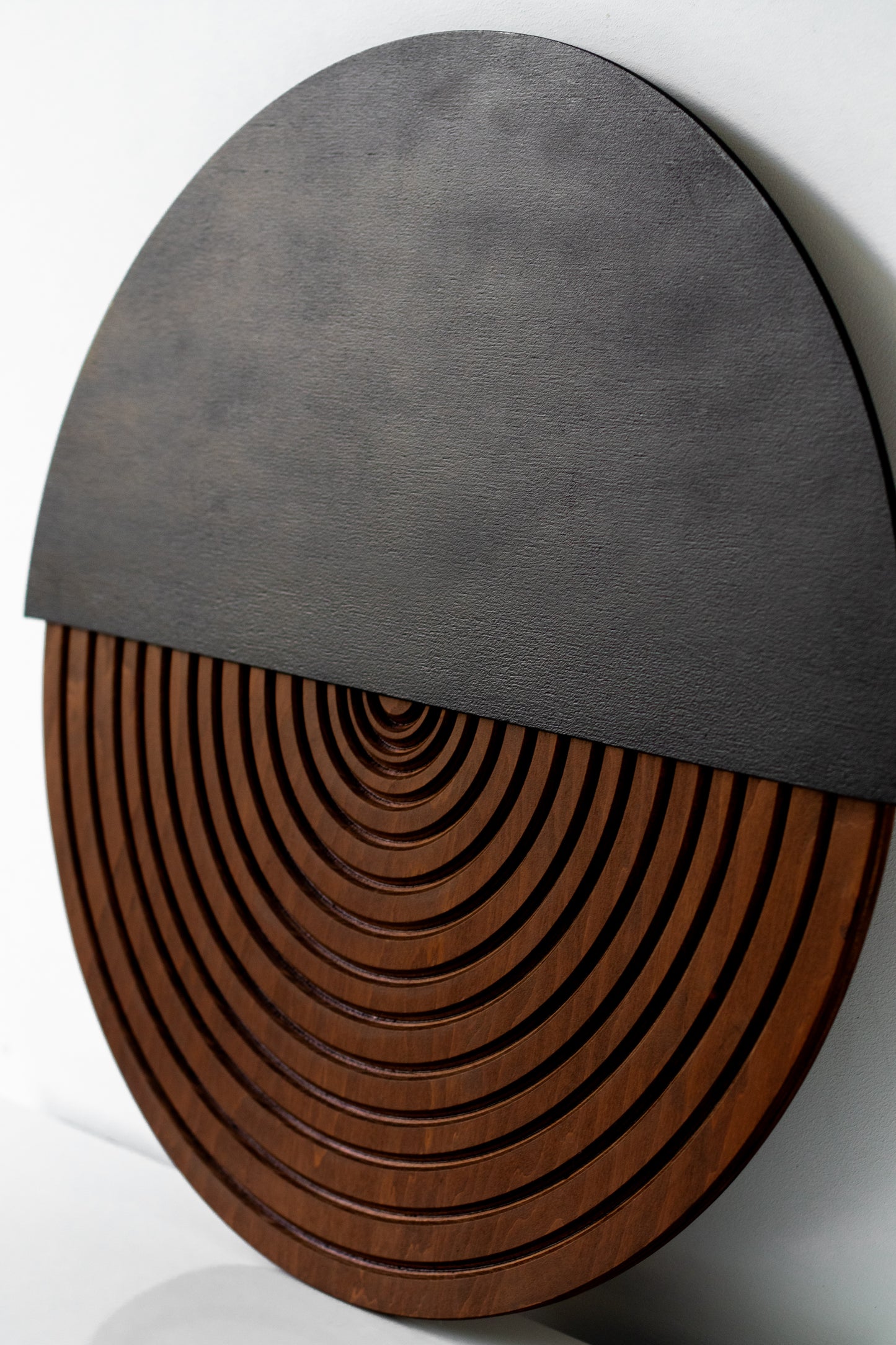 Modern geometric wood wall art made of black and brown plywood