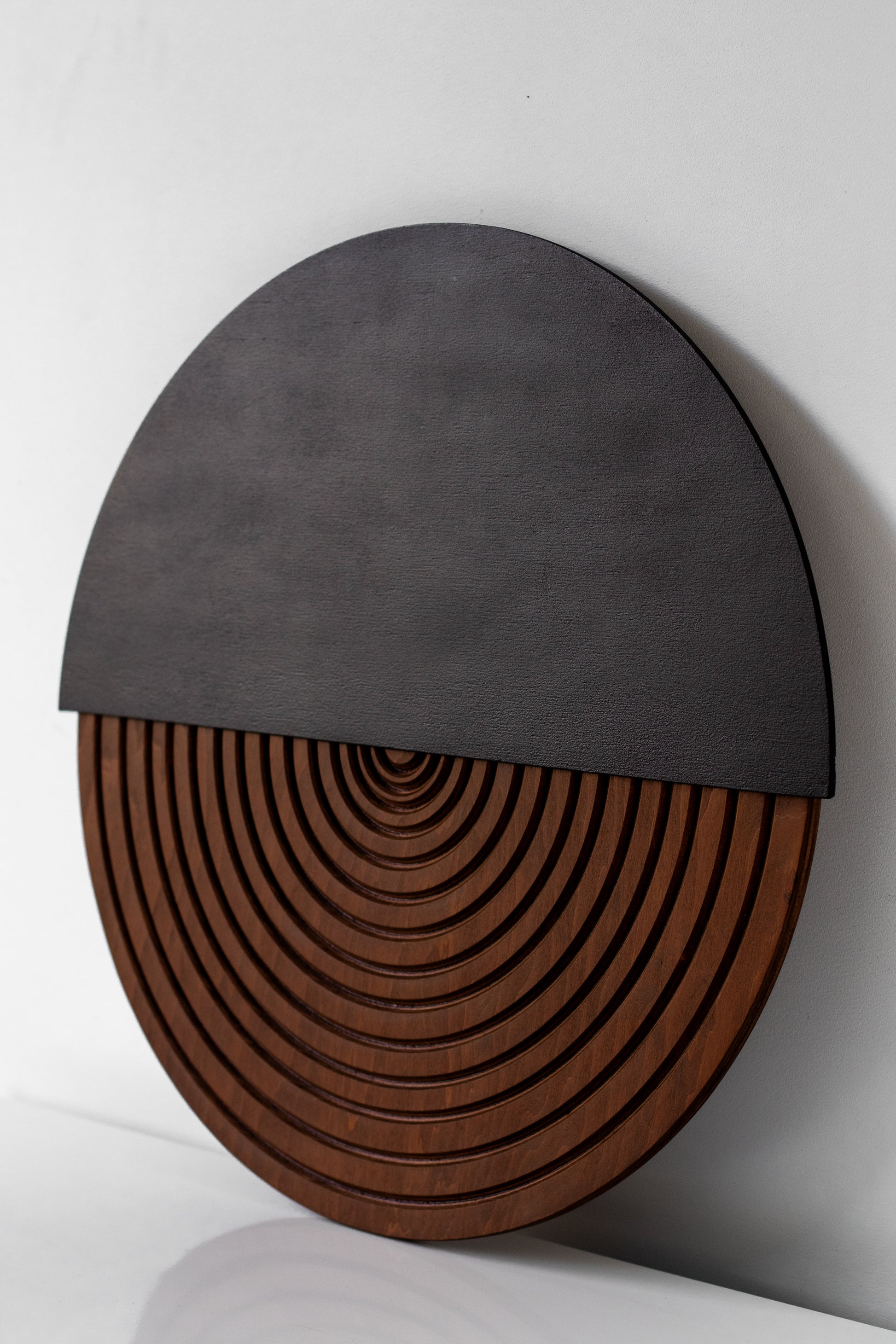 Handmade wooden wall sculpture with curved design, modern interior accent
