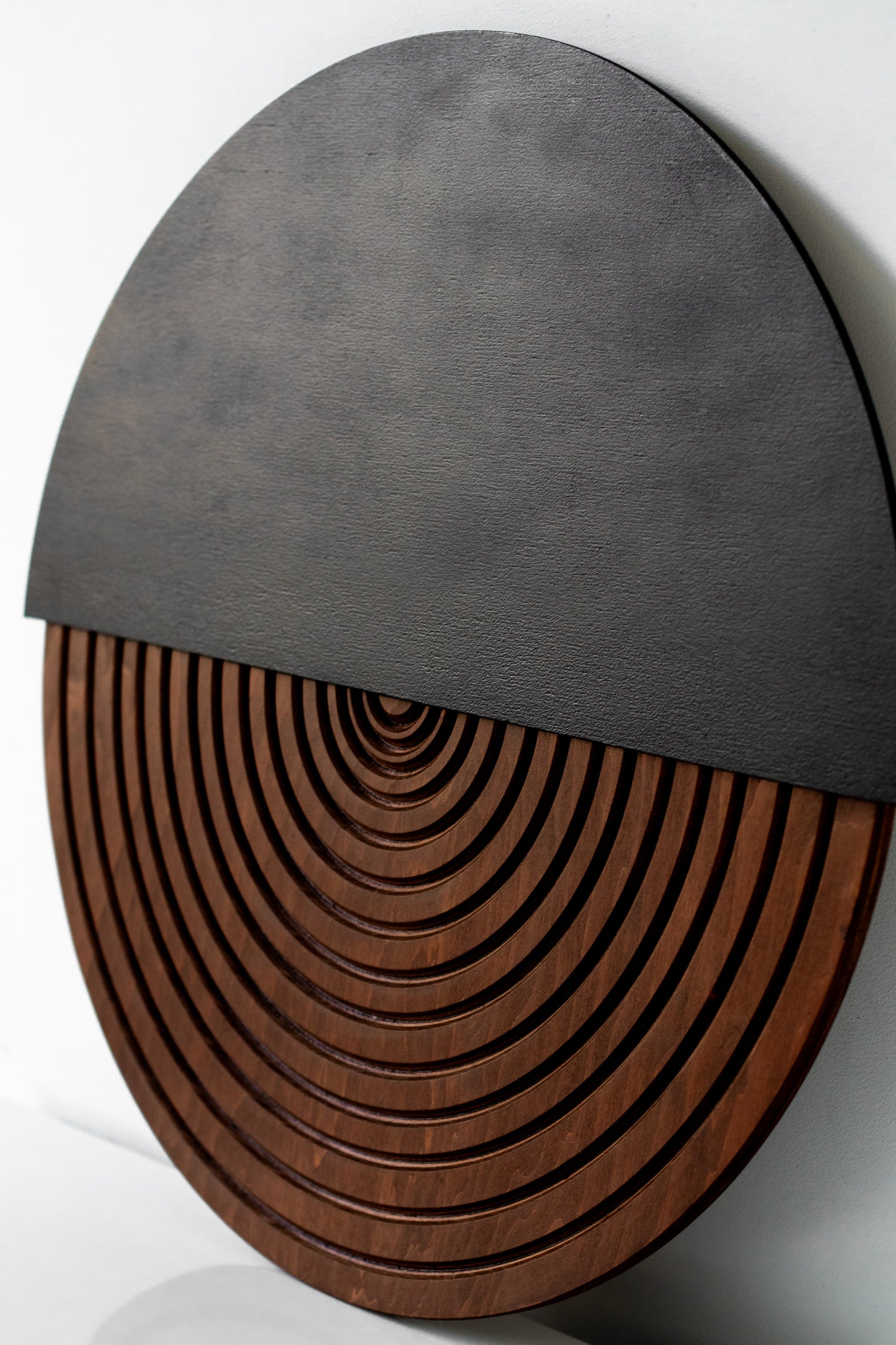 Circular modern wall decor made of layered natural wood panels