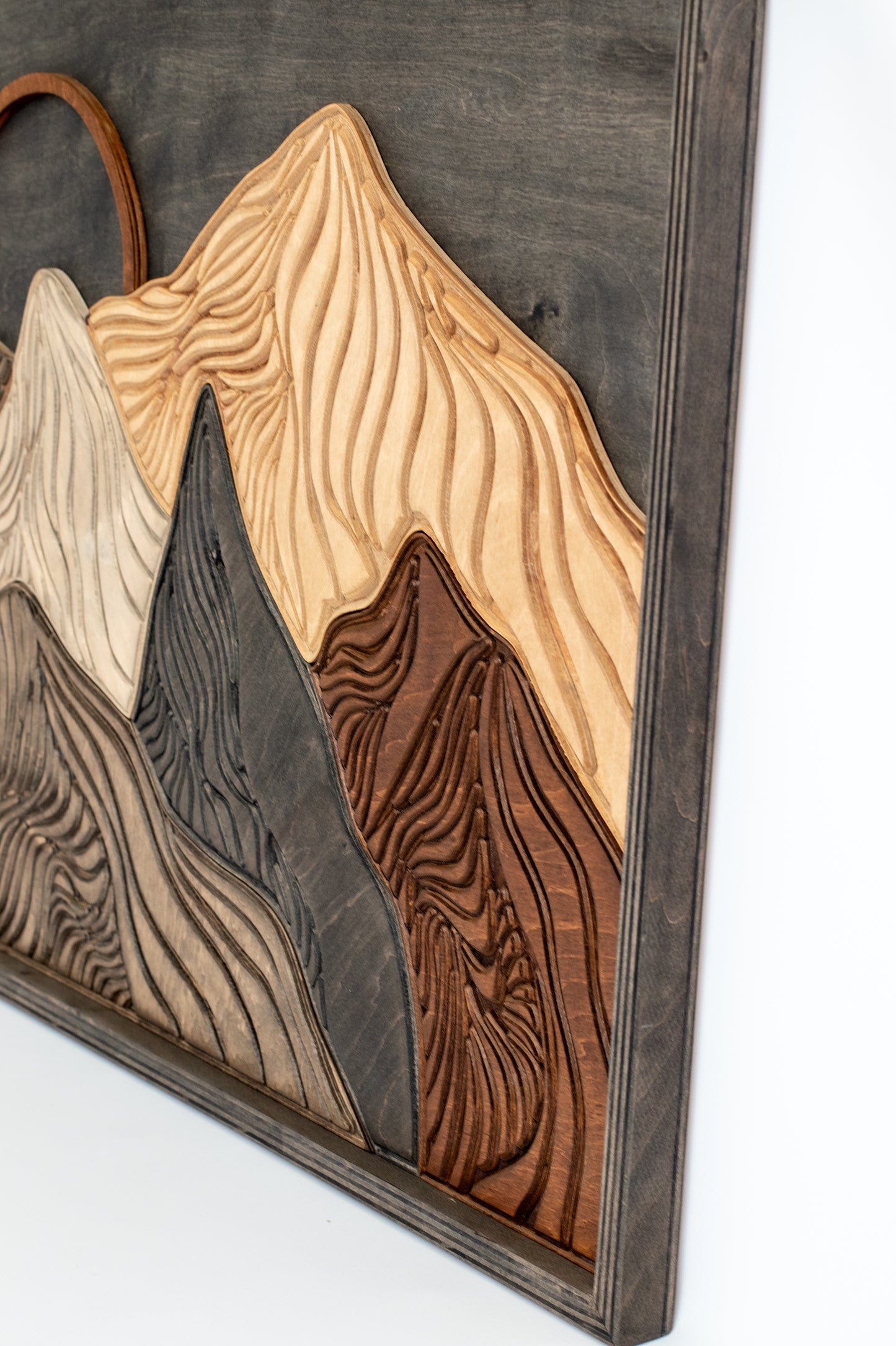 s for modern wall décor.

Layered wooden mountain artwork