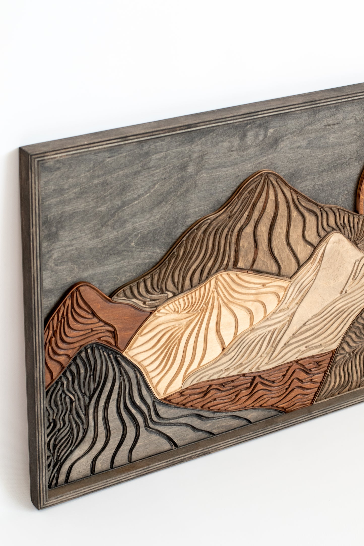 Modern rustic wooden mountain wall piece with geometric layered peaks and natural grain texture for stylish home decoratio