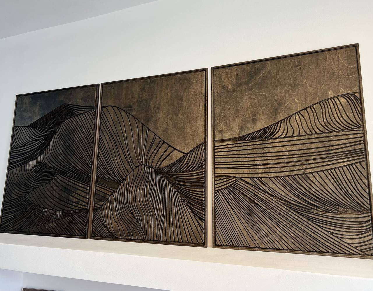 Carved wood mountain triptych